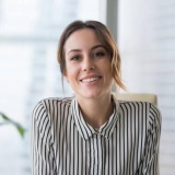 A Women smiling to the camera