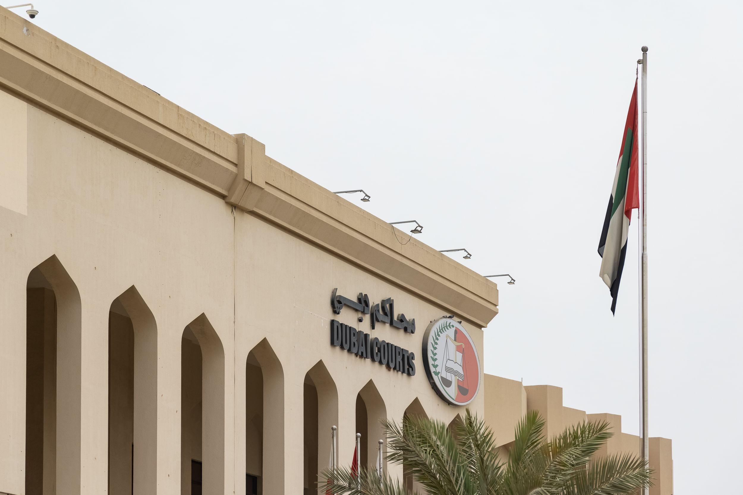 image of Dubai Courts and United Arab Emirates flag